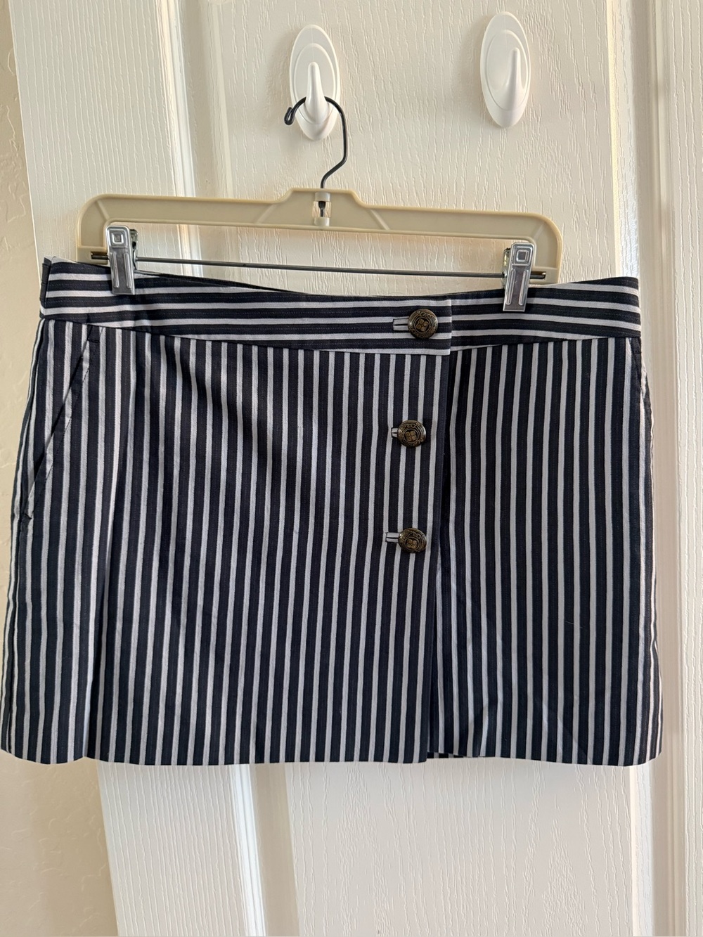 BCBG MAXAZRIA navy and white nautical-inspired striped wrap mini skirt.